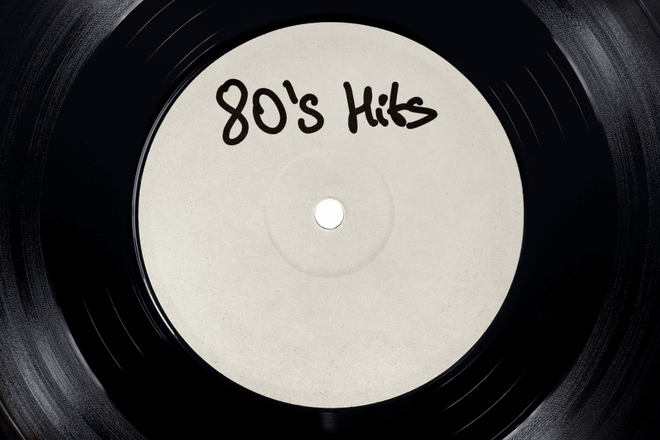 Zoomed in record disk that says "80's Hits"