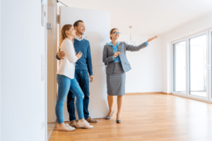 Leasing agent showing couple an available apartment unit.