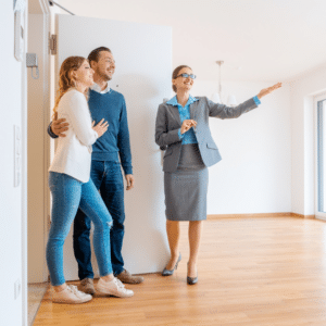 Leasing agent showing couple an available apartment unit.