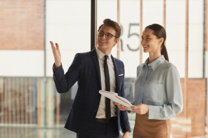 man leasing agent showing woman an apartment