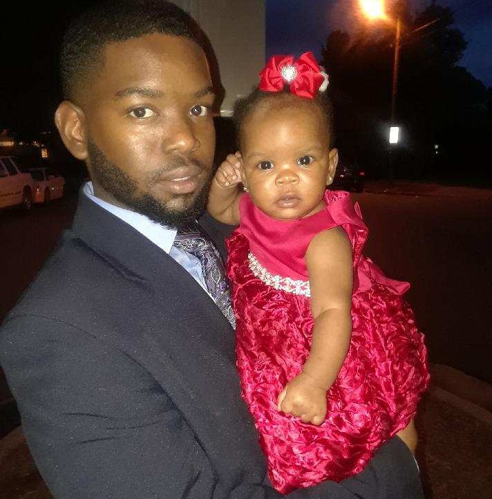 J'Quan with his 8-month-old daughter