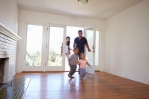 Young family excitedly entering a rental properly.