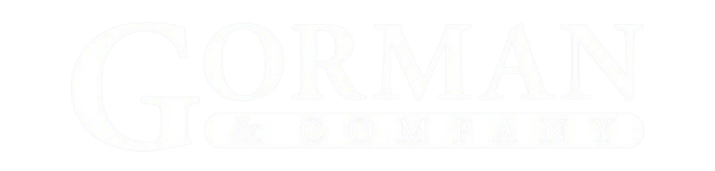 all white logo of gorman and company