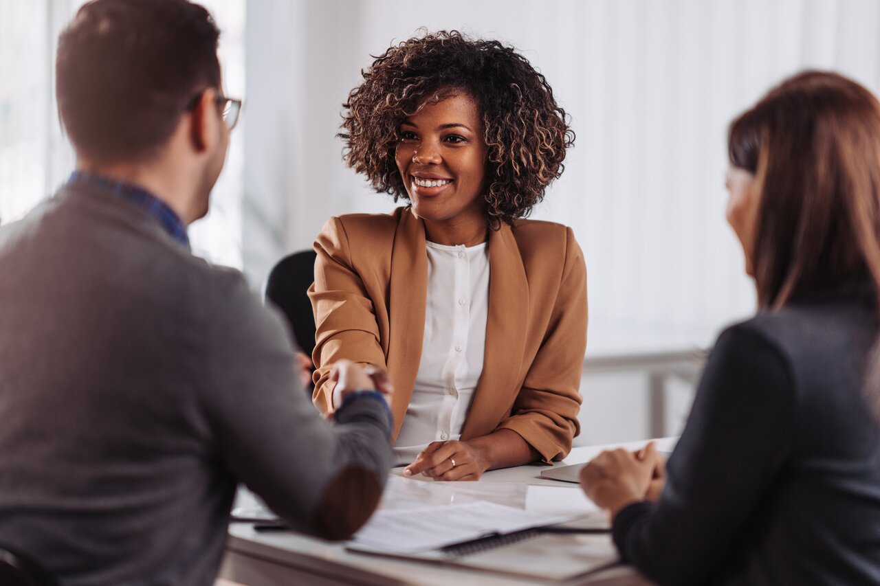 Business people shaking hands after successful meeting