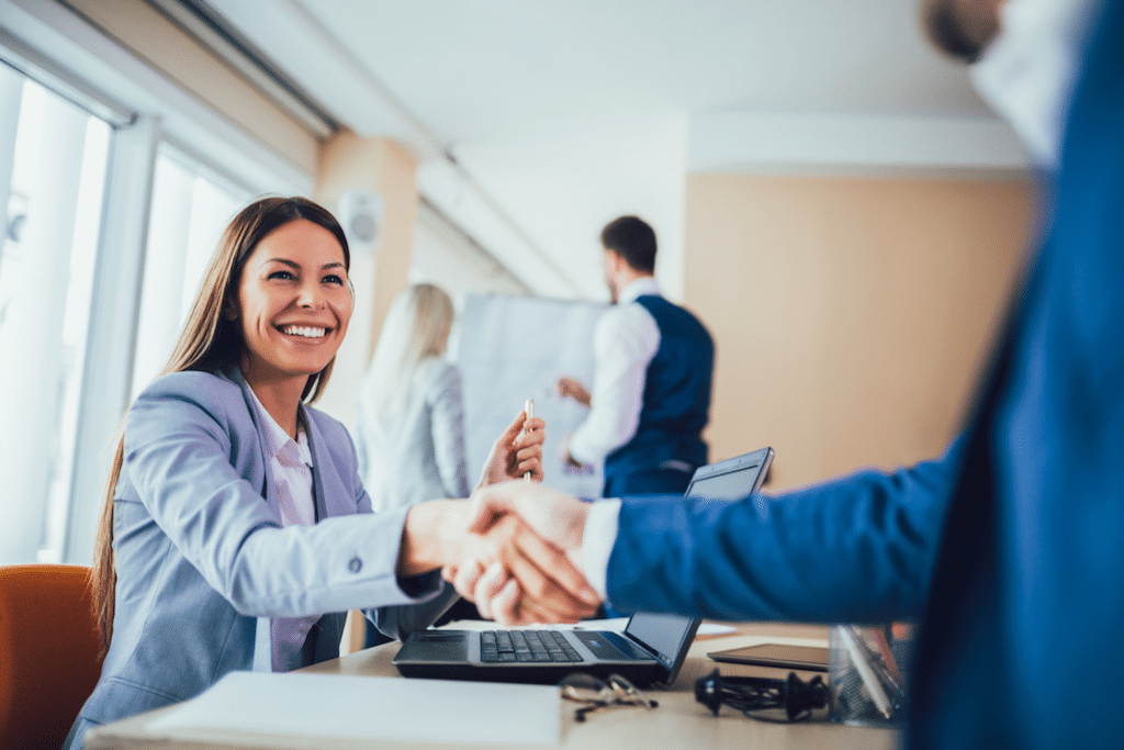 property management leasing office customer service agent shaking hands