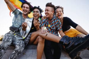 Blog Beyond Tokenism Young people celebrating gay pride outdoors LGTBQ+