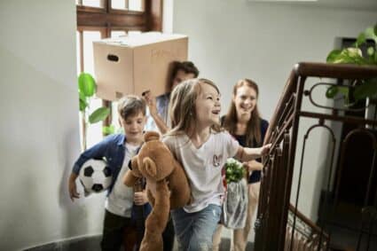 Close up of a young family moving home