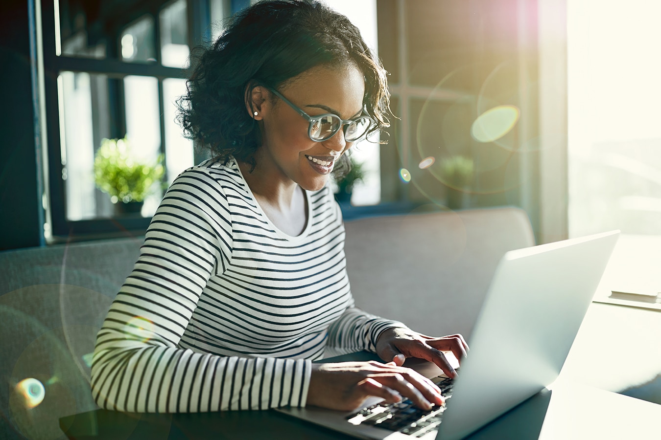 Young African woman smiling and working online with a laptop
adult, african, african american, alone, black, business, business person, business woman, businessperson, businesswoman, casual, computer, connected, copy space, entrepreneur, ethnic, ethnicity, female, glasses, happy, high angle, indoors, inside, internet, laptop, lens flare, modern, office, one, online, person, positivity, self employed, sitting, small business, small business owner, smiling, social media, startup, student, studying, technology, wireless, woman, working, working from home, young
Young African woman wearing glasses sitting by herself at a table using a laptop to browse online