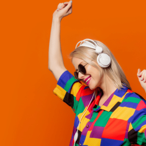 Woman dressed like she's from the 90s, wearing headphones and dancing