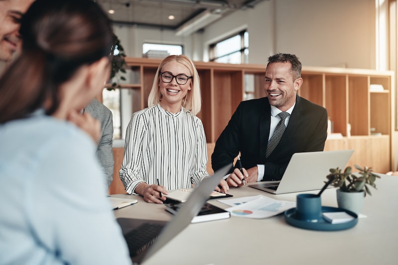 Group of diverse businesspeople laughing while having a meeting together around a table in an office
Laughing group of businesspeople working around an office table
adults, business, businessmen, businesspeople, businesswomen, caucasian, colleagues, corporate, coworkers, diversity, employee, entrepreneurs, executive, girls, group, happy, laptop, laughing, lens flare, meeting, men, office, office worker, people, professional, smiling, staff, standing, startup, successful, talking, team, white, women, working, workplace