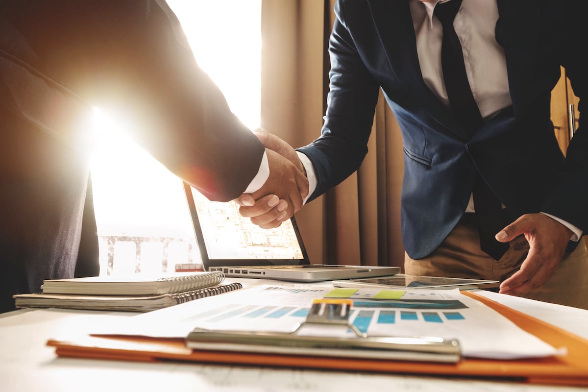 commercial real estate owners shaking hands