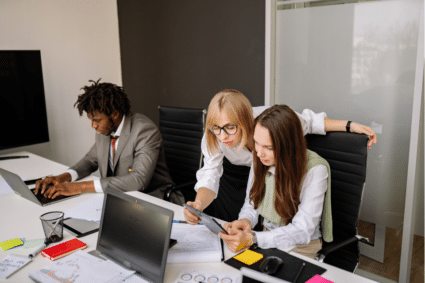 employee using laptop to onboard in multifamily