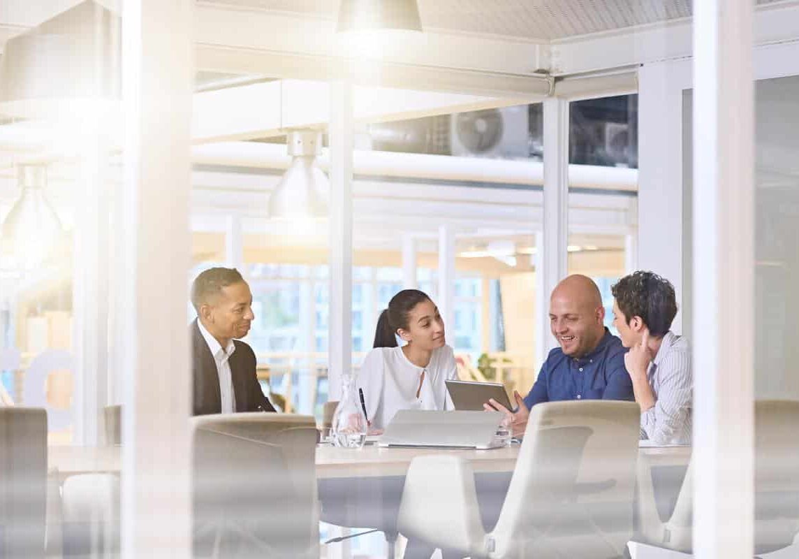 Tenant surveys can help your organization early morning sunrise business meeting in modern office conference room