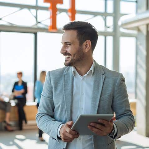 Handsome businessman holding a digital tablet taking a tenant survey