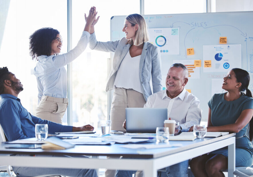 Business teamwork high five celebrate deal success, target and winner motivation working in multifamily marketing.