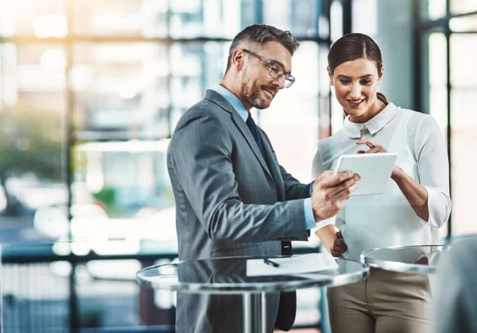 commercial real estate stakeholders taking a satisfaction survey on tablet
