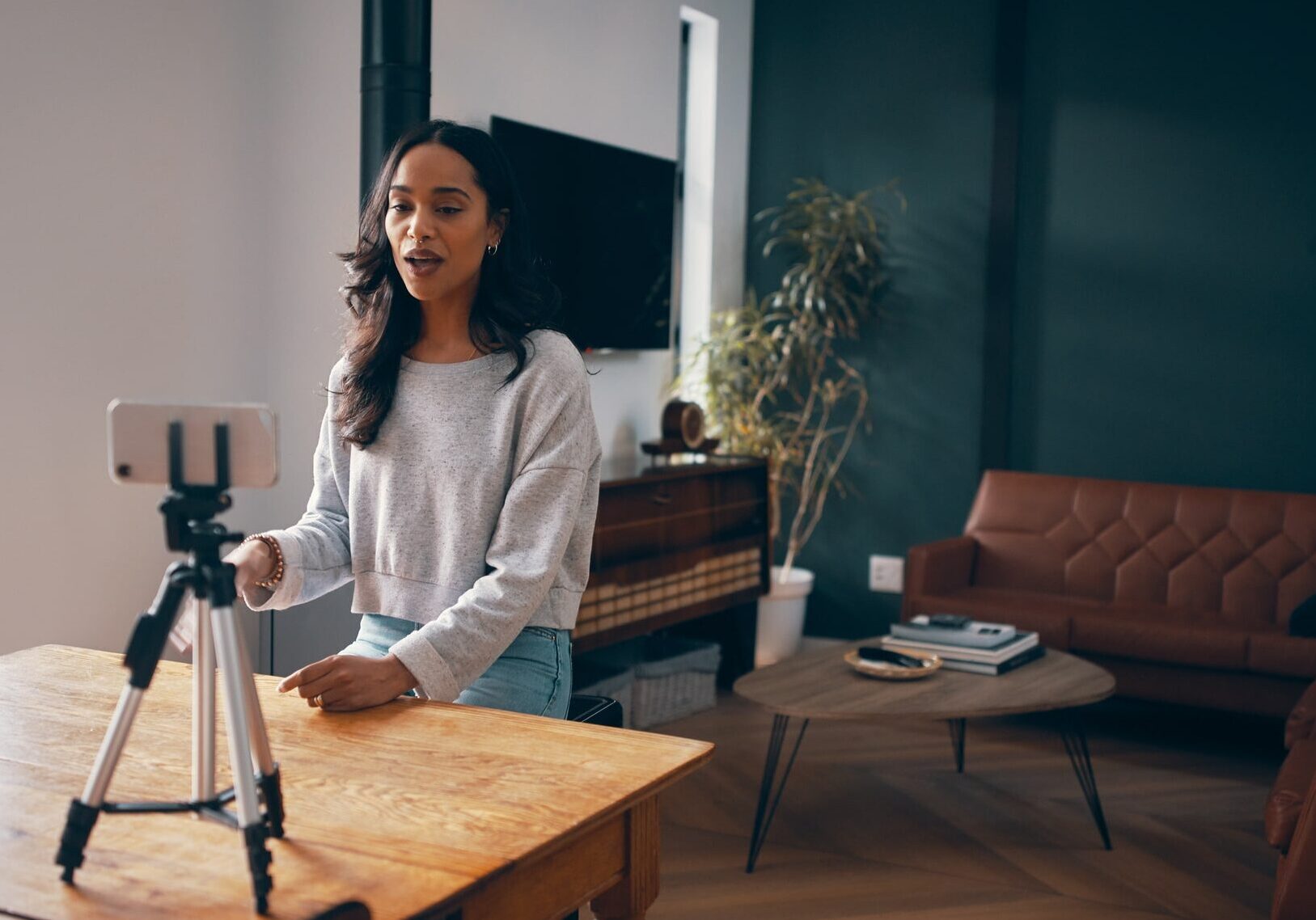 Shot of an leasing agent woman using a realync to record a virtual apartment tour
