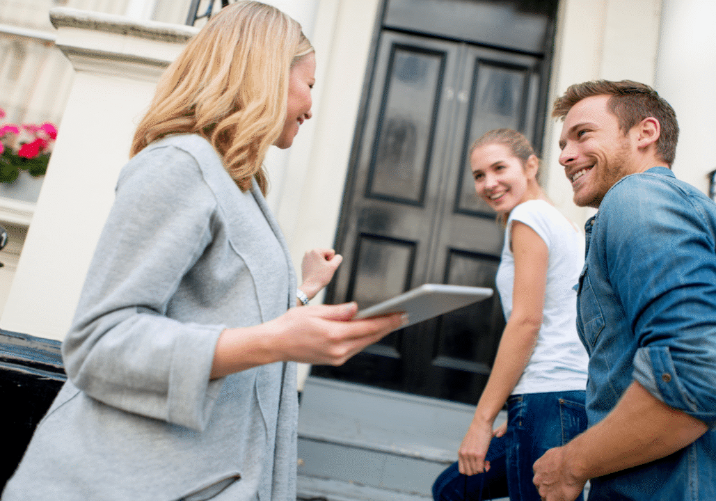 leasing agent giving prospective residents a tour of apartment