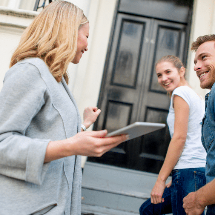leasing agent giving prospective residents a tour of apartment