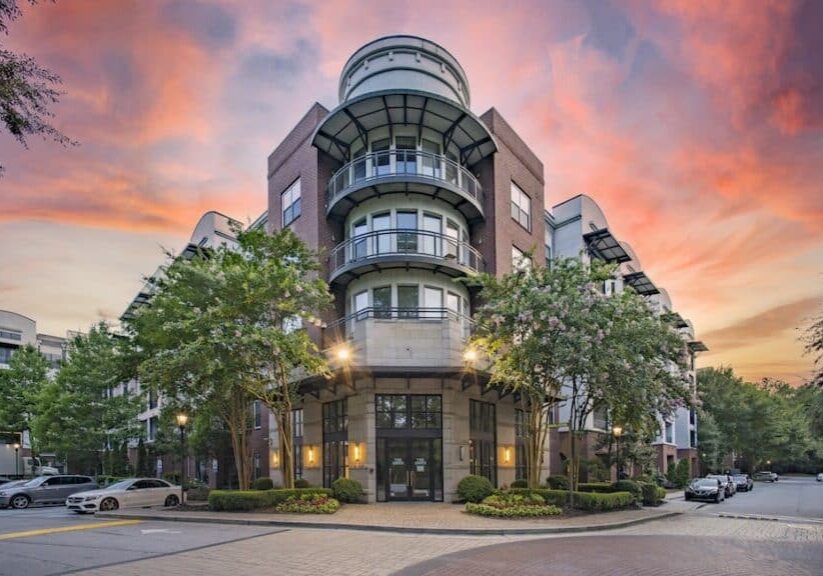 The Ren Leasing office exterior at dusk fogelman property